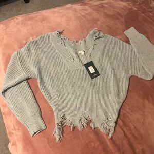 Distressed crop sweater